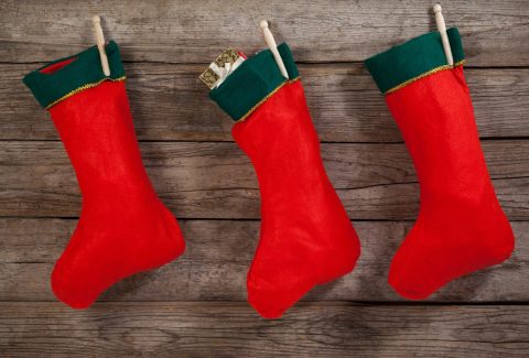 Christmas stocking hanging against wooden wall