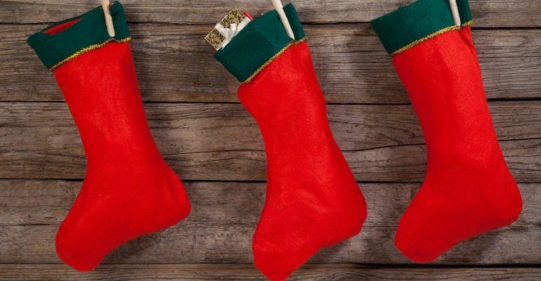 Christmas stocking hanging against wooden wall